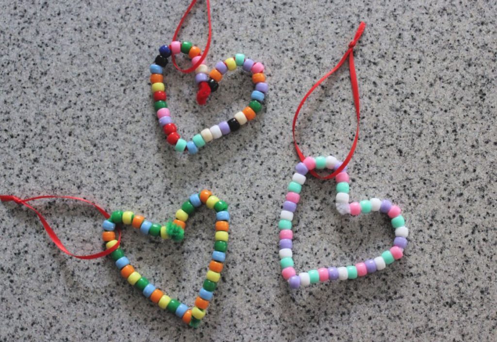 heart shaped ornaments for kids made with pony beads threaded onto pipe cleaners